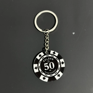 Detail of creative acrylic poker chip keychain with silver metal ring and 50 digits