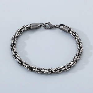 Detailed view of vintage silver titanium steel twisted chain bracelet with lobster clasp