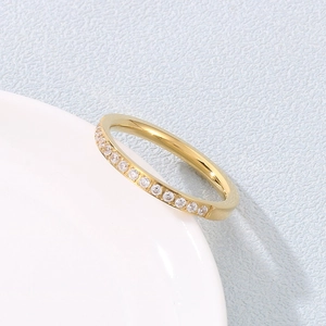 Macro detail of gold-plated stainless steel ring with micro-pave white zircon stones