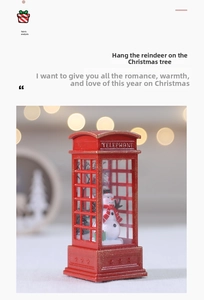 Macro shot of red Christmas telephone booth ornament with cute snowman and glitter finish