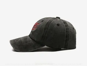 Detail of vintage washed grey baseball cap with American flag side embroidery and curved brim