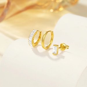 Detail of S925 sterling silver earrings set with zircon stones on geometric props