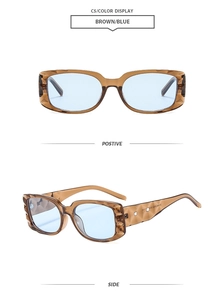Détail de lunettes de soleil carrées avec monture marron et branches à texture ondulée