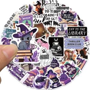 Close-up of Gothic magic bookish stickers featuring black cat and witch themes