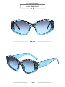 Detail view of blue tortoiseshell cat-eye sunglasses with gradient lenses