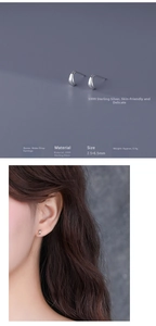 Detailed view of S999 silver teardrop studs with size 2.5x6.5mm on model ear