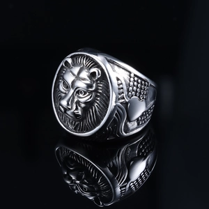 Macro shot of lion head ring featuring detailed mane texture and silver finish