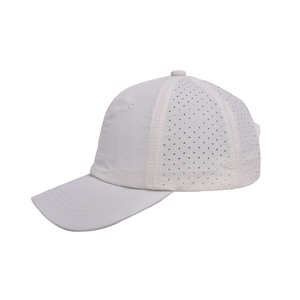 Detail of white baseball cap with laser-cut side mesh holes for enhanced breathability