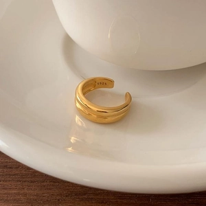 Minimalist double layer S925 sterling silver gold plated ring shown on ceramic base
