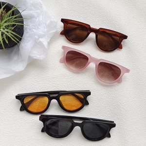 Fashionable unisex square sunglasses set in various colors on minimalist white background