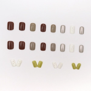 Glossy multi-color press-on nails set in olive green and metallic silver tones