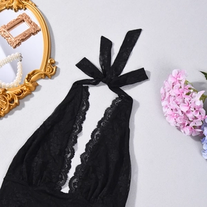 Detailed close-up of floral black lace backless dress with elegant scalloped neckline edge