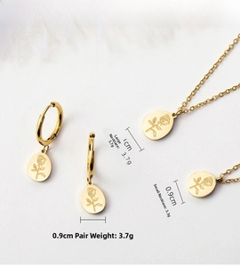 Detailed view of gold rose jewelry set including oval pendant necklaces and earrings