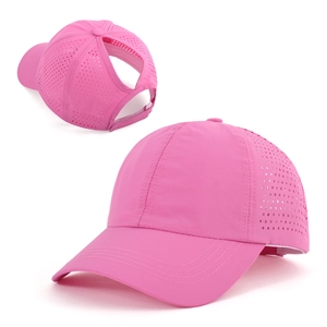 Detail view of pink ponytail baseball cap with laser-cut breathability and velcro strap