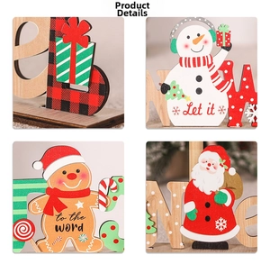 Detail of hand-painted wooden Christmas signs with snowman and gingerbread man patterns