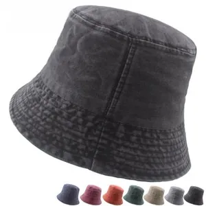 Close-up of vintage washed cotton bucket hat with breathable metal eyelets in multiple colors