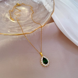 Titanium steel necklace with teardrop emerald green gemstone and pave crystals on glass