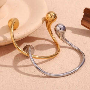 Minimalist open cuff bracelet in gold and silver finish with double water drop ends