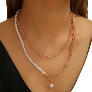 Elegant gold layered chain necklace with white pearls and OT toggle clasp on model
