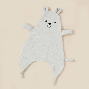 Detail of soft light gray cotton muslin baby security blanket with embroidered bear face