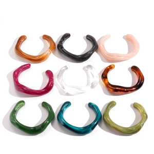 Set of 9 colorful acrylic geometric twisted open bangles with bohemian resin patterns