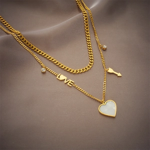 Double-layer gold necklace featuring heart, arrow, and LOVE pendants with zircons
