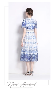 Detail of hollow-out water-soluble lace and vintage blue floral embroidery on dress