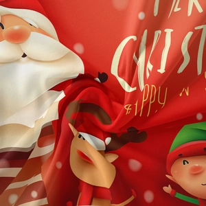 Detail of soft red Christmas tapestry with festive Santa and reindeer digital prints