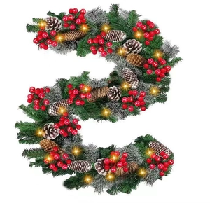 Detailed view of 2.7m Christmas garland with pine cones, berries and warm LED lights