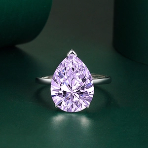 Elegant pear-cut purple gemstone ring in silver-tone adjustable open setting