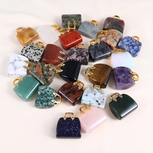 Close-up of assorted mini crystal handbag pendants in various colorful gemstones