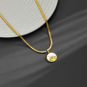 Golden tree of life necklace with white shell pendant on a polished snake chain