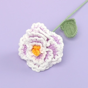 Handmade crochet peony flower with white and purple gradient petals and green leaves