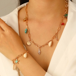 Bohemian gold chain necklace and bracelet set with seashell and starfish charms