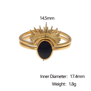 Detailed view of sunburst gold ring with black stone inlay and technical dimensions