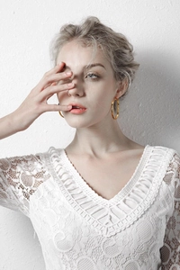Elegant 18K gold-plated titanium steel large hoop earrings on model for a chic style