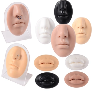 Silicone nose and lip model set on acrylic stand for piercing practice and jewelry display
