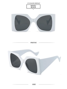 Detailansicht der weißen quadratischen Sonnenbrille mit schwarzen Gläsern und breitem Bügel