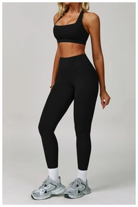 Detail of black backless yoga set featuring a halter top and high-waisted leggings