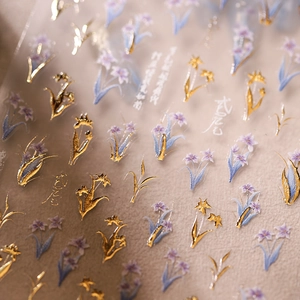 5D iris nail stickers with purple petals and golden foil accents on transparent base