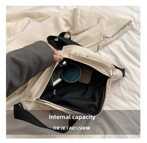 Interior view of off-white crossbody bag showing spacious capacity for phone and cosmetics