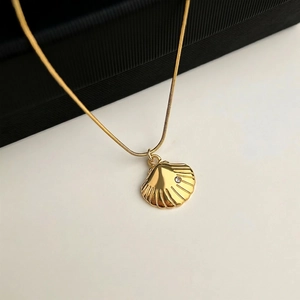 Gold shell pendant necklace in 18K plated stainless steel with small zircon accent