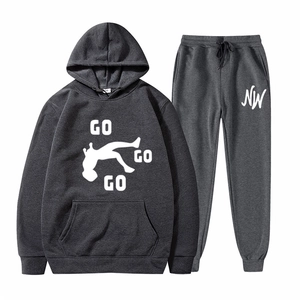 Close-up of dark grey waffle knit tracksuit with GO GO GO print and textured fabric detail