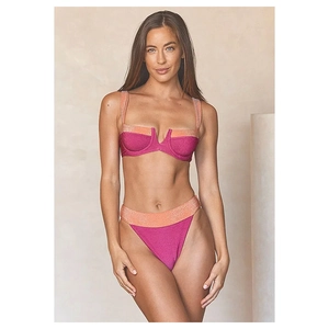 Detail of neon pink and glitter orange high-waist bikini with V-shaped metal hardware