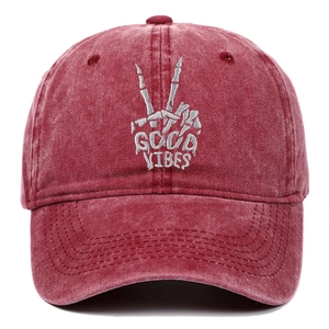 Vintage washed red baseball cap with white skeleton hand and Good Vibes embroidery