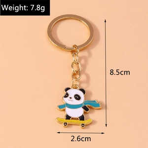 Detail view of cute panda keychain dimensions and weight 7.8g on pink background