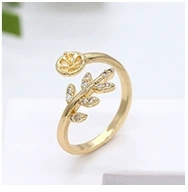 Macro detail of leaf-shaped adjustable ring with cubic zirconia and round pearl base