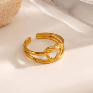 18K gold-plated stainless steel hollow heart open ring on stone and glass props