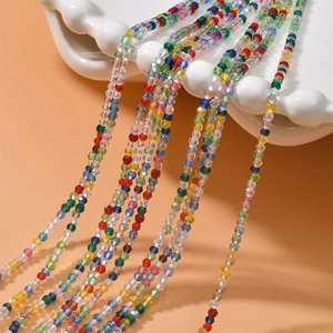2mm faceted colorful crystal beads strands for DIY jewelry making on white ceramic plate