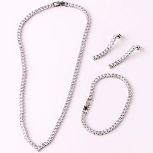 Silver V-shaped jewelry set featuring cubic zirconia necklace, bracelet and stud earrings